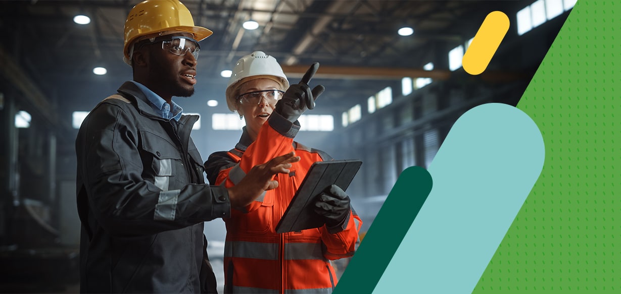Two colleagues in a warehouse with tablet PC