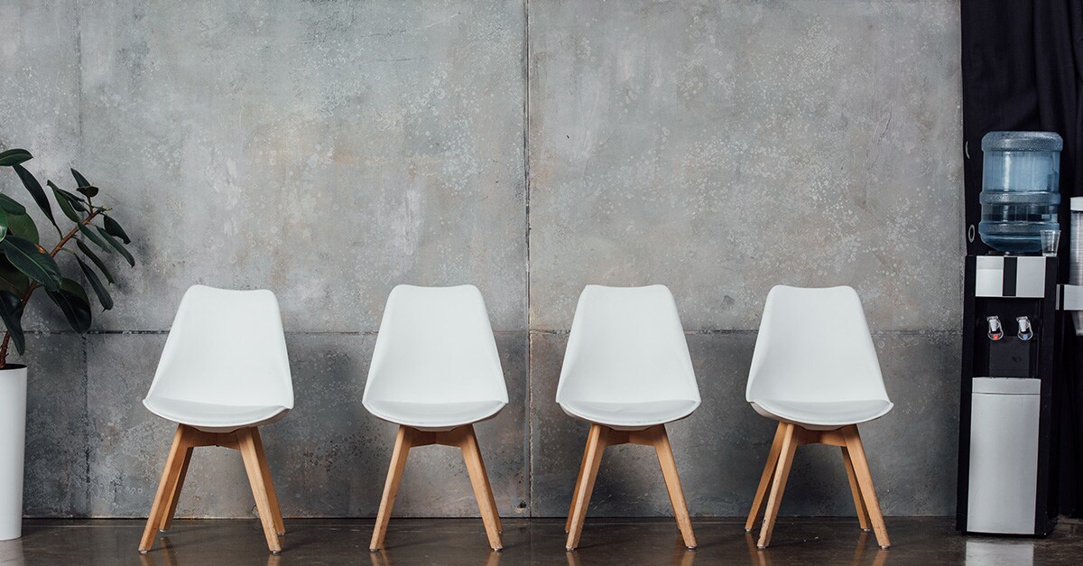 Empty chairs next to water cooler