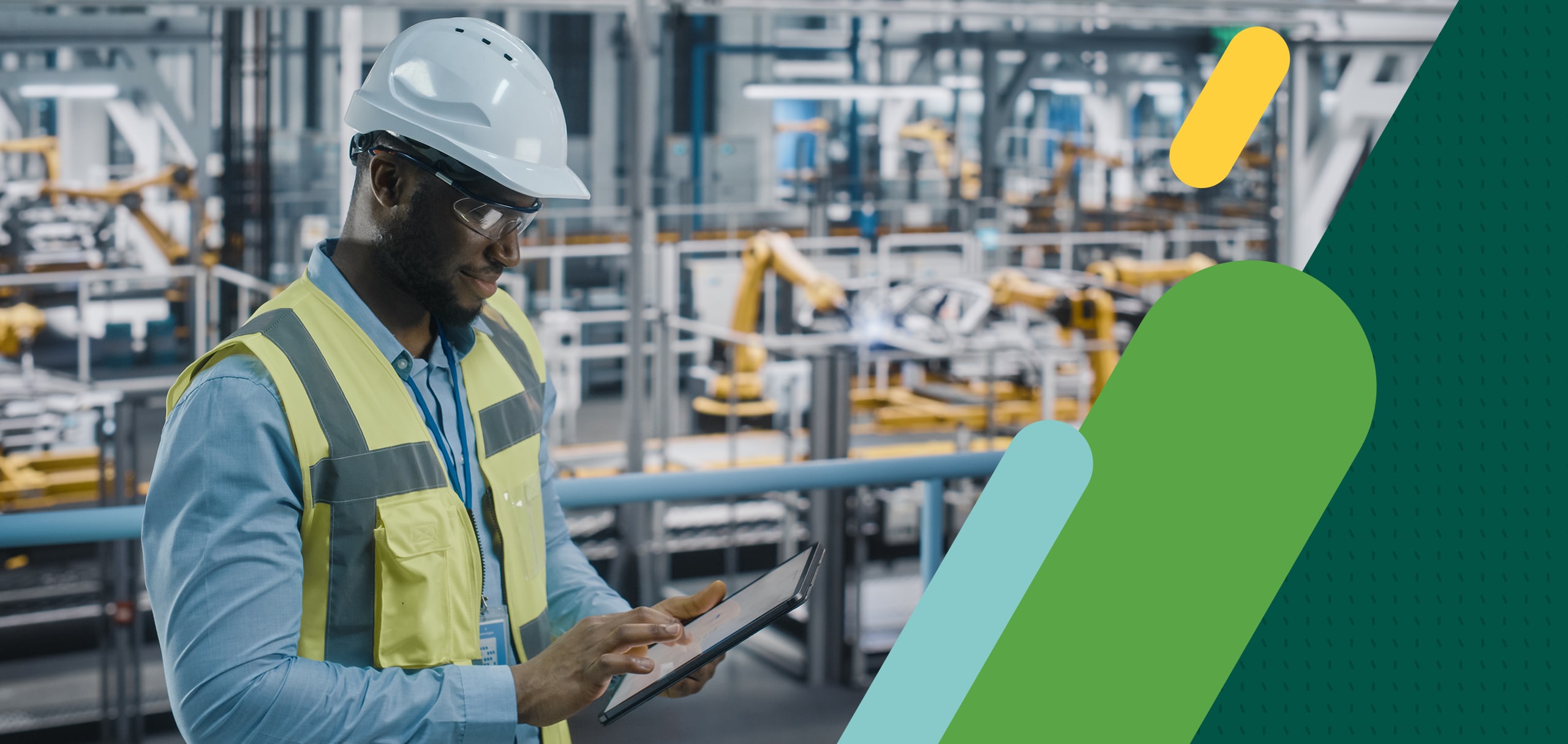 Man wearing hardhat working on ipad