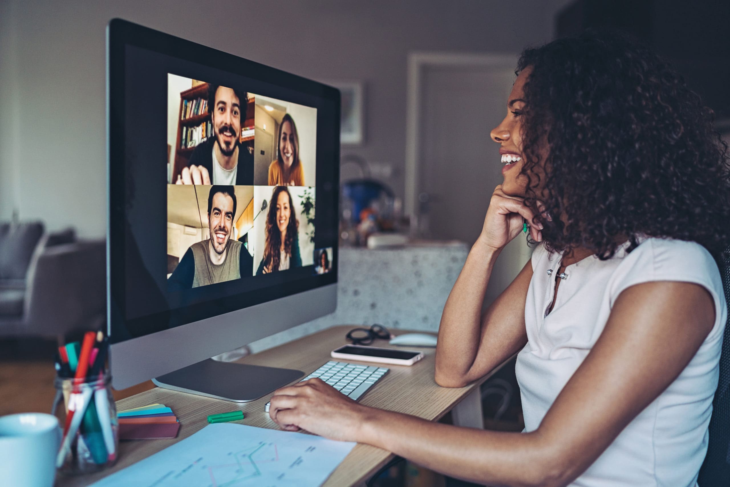 Woman on virtual call with colleagues